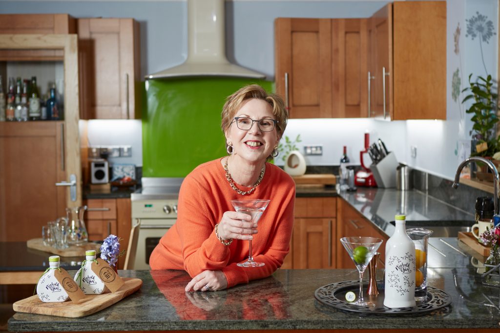 Alison enjoying a Norfolk Gin at home.