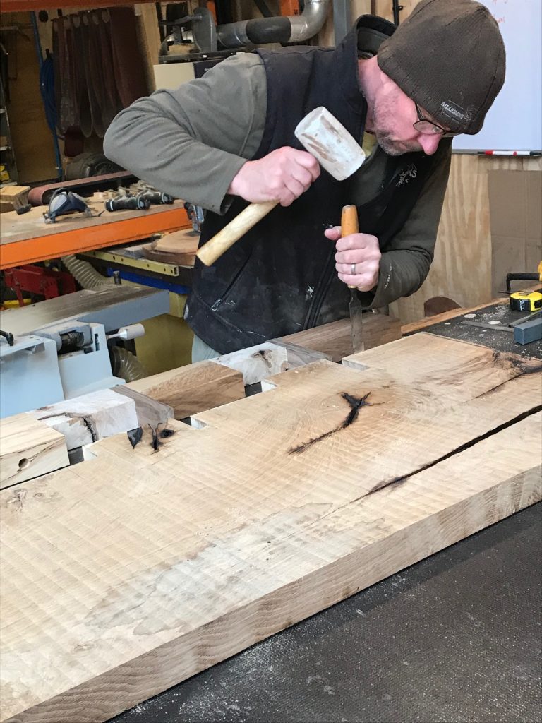 Jon working on a table